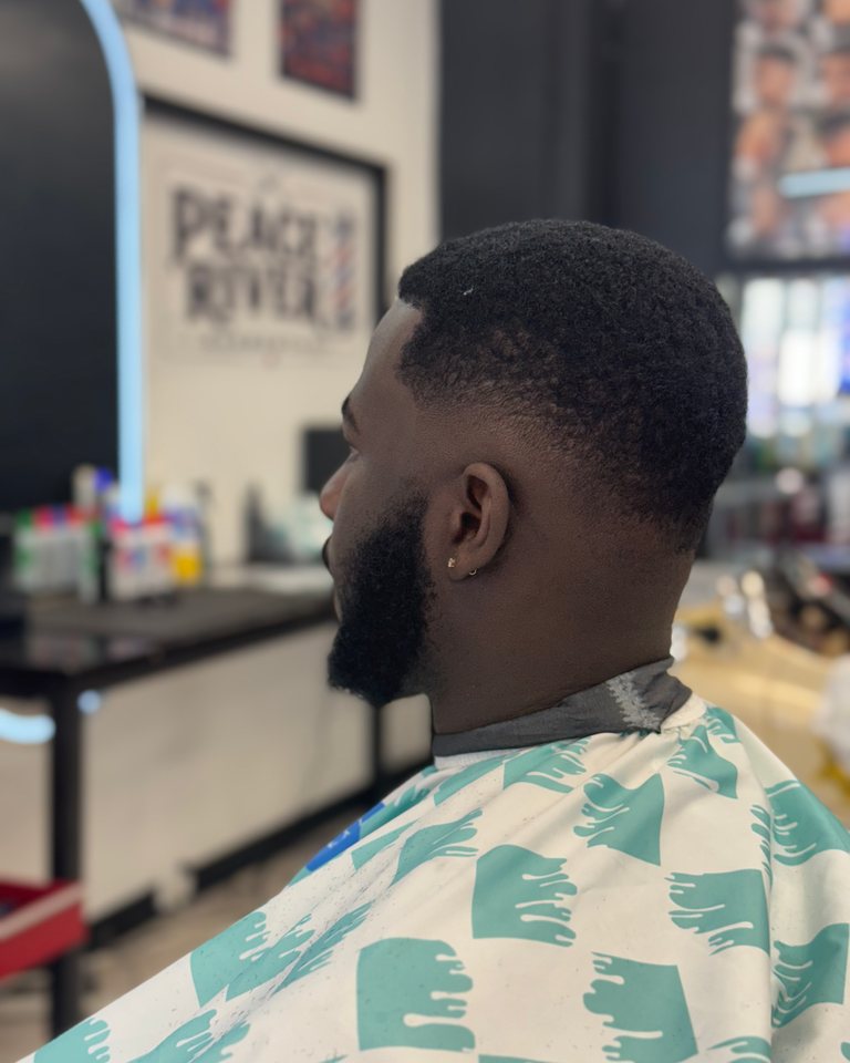 Finished textured haircut with a carefully blended fade and beard