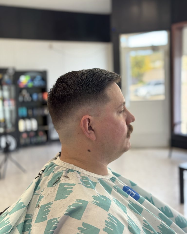 A finished short haircut seen from the opposite side