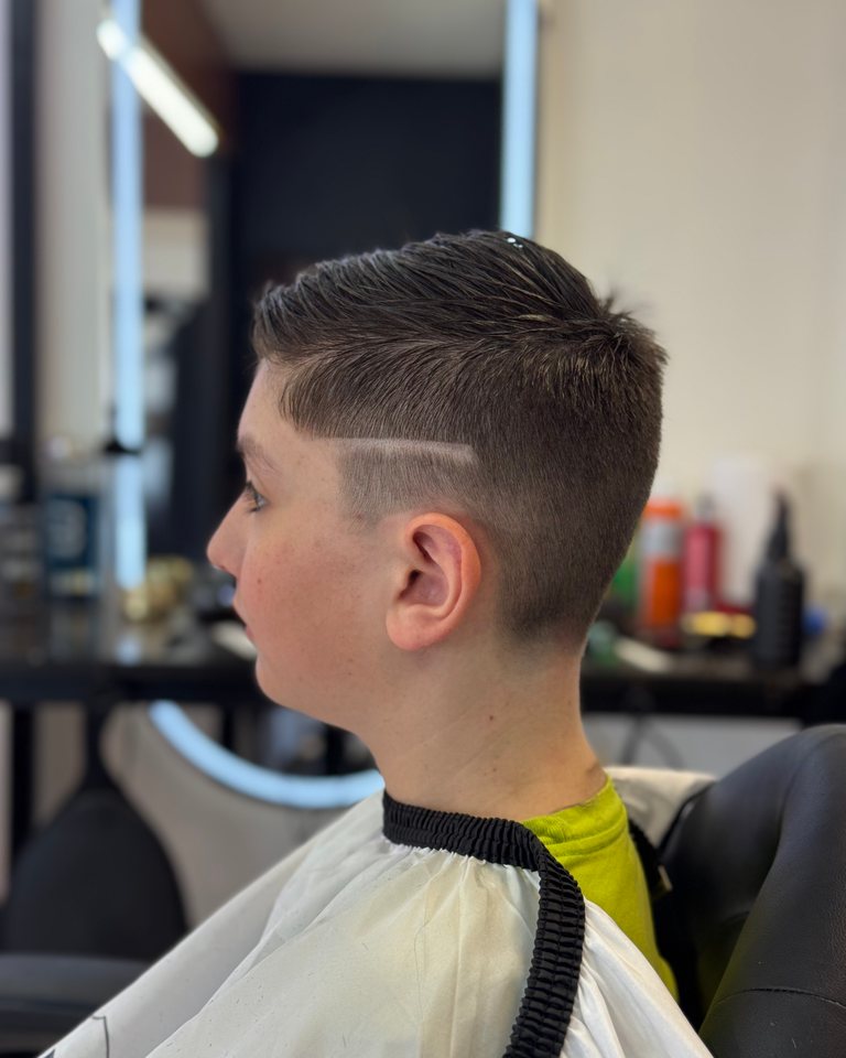 Finished kids haircut with a tidy neckline and sides