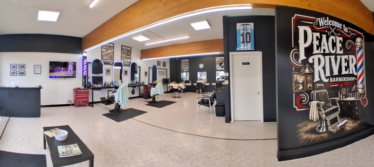 Inside Peace River Barbershop, with mirrors and barber stations